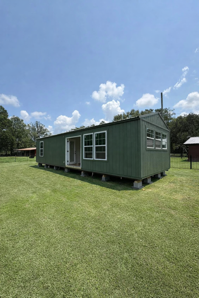 Customer Buildings, Portable Buildings, Sheds, Cabins, Carports, Metal Buildings, Garages, Barns, Workshops For Sale at Johnson Portable Buildings in Covington, Louisiana. (Also serving surrounding towns including Mandeville, Madisonville, Abita Springs, Lacombe, Slidell, Folsom, New Orleans, Metairie, Kenner, etc.)