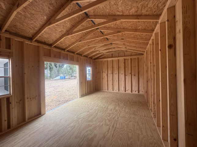 interior of 12x20 shed Covington LA showing open storage space and wood flooring