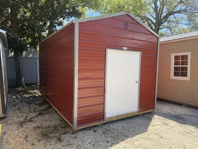 10x16 red metal utility shed with white door in Covington Louisiana