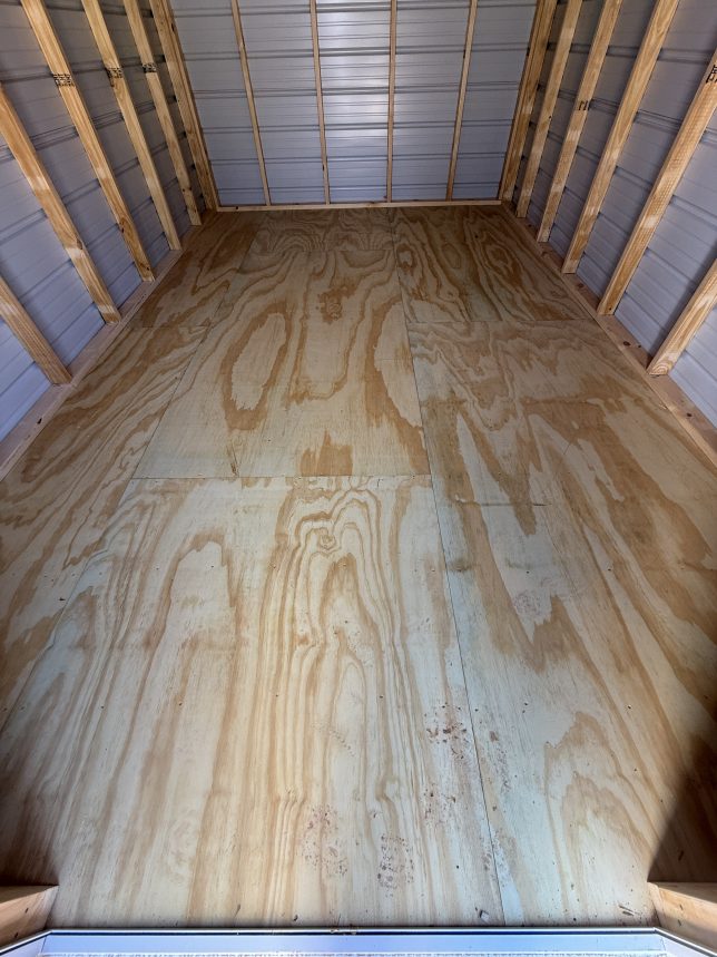 Treated plywood flooring inside portable shed tongue and groove wood floor