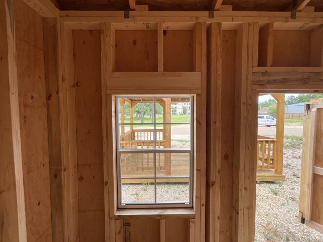 House-style window framing inside portable garden shed