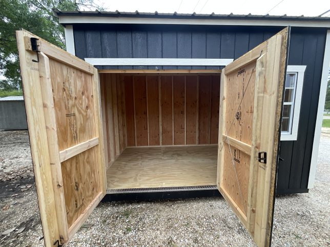 8x12 garden shed with open double wood doors showing interior storage space
