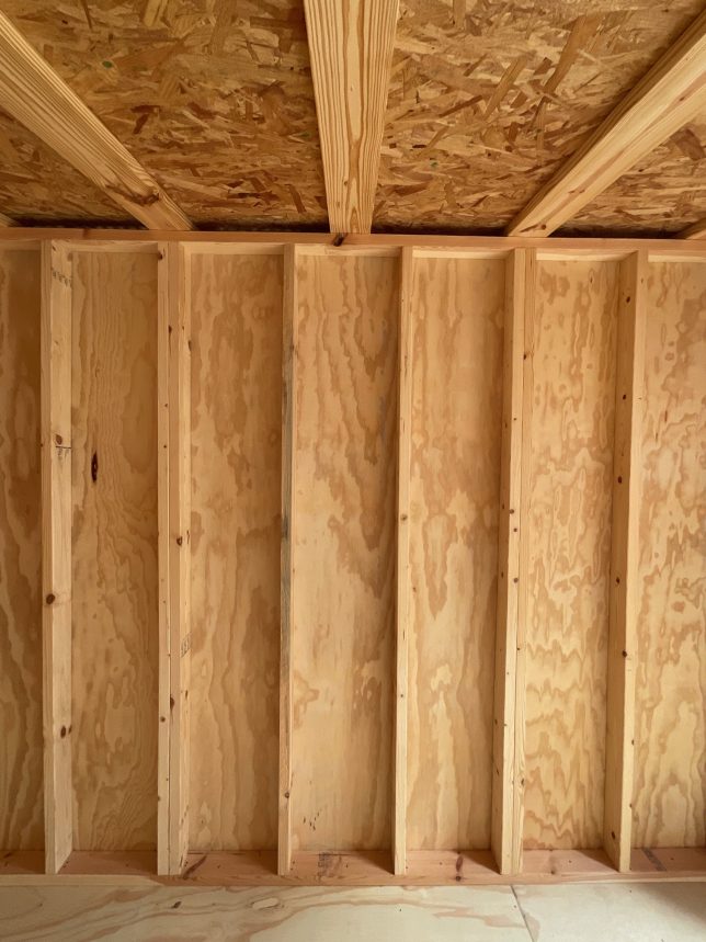Wall and roof trusses inside Urban Shed