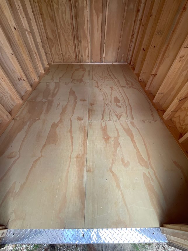 Heavy-duty wood floor inside Urban Shed