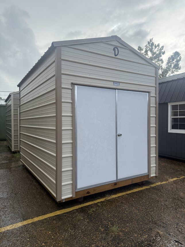 Left-front view of a 8×12 metal storage shed with gable roof, double doors, and durable metal siding.